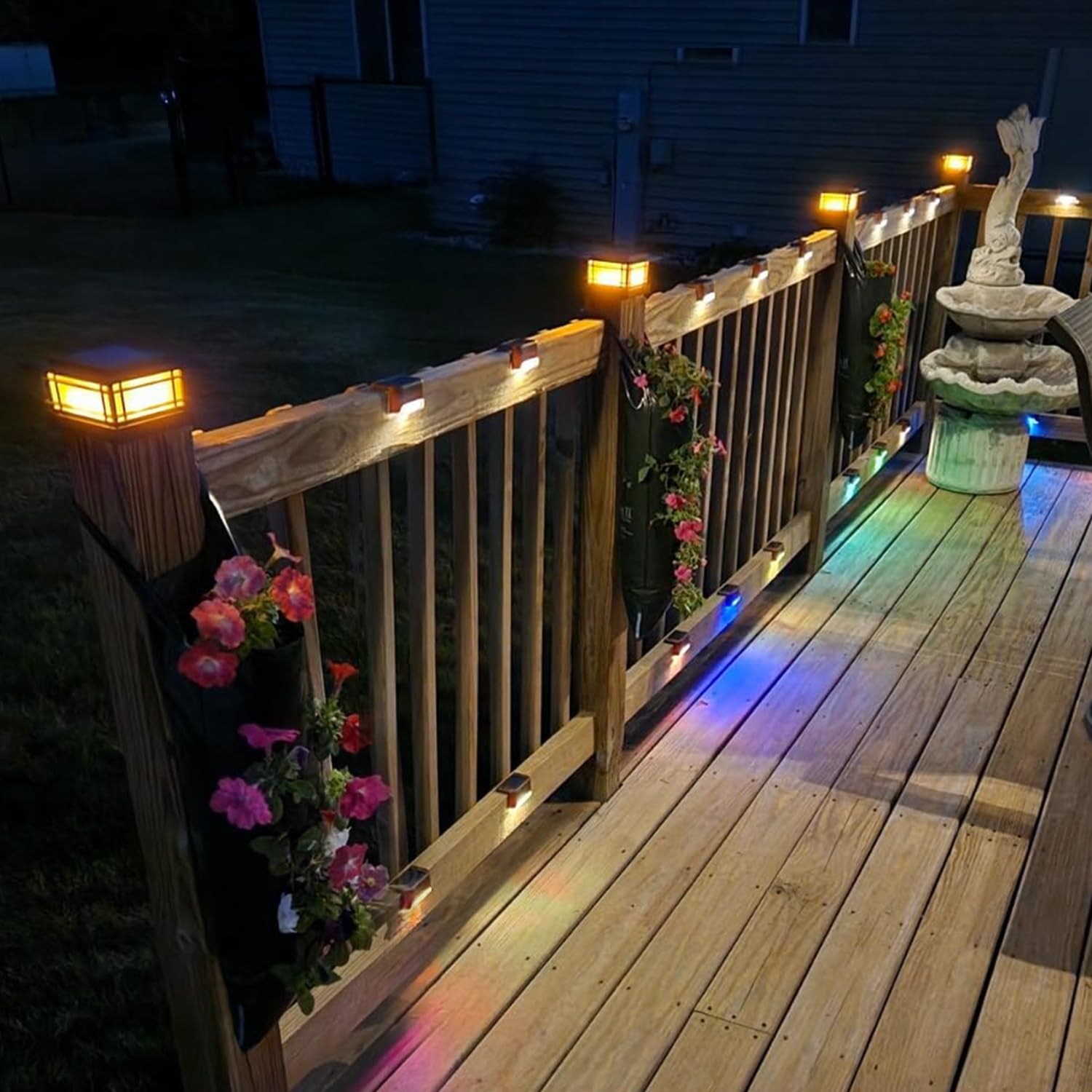 Post cap lights on deck railing at night