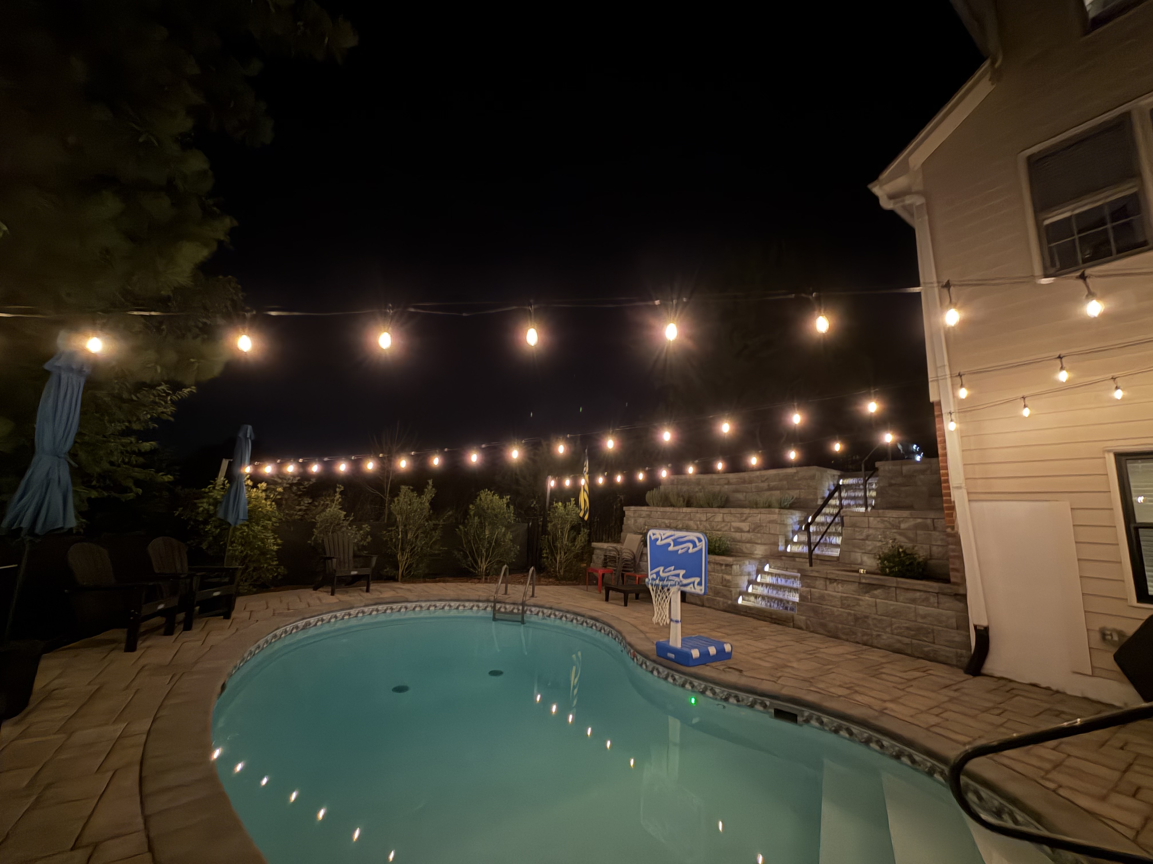 Bistro lights over pool detail