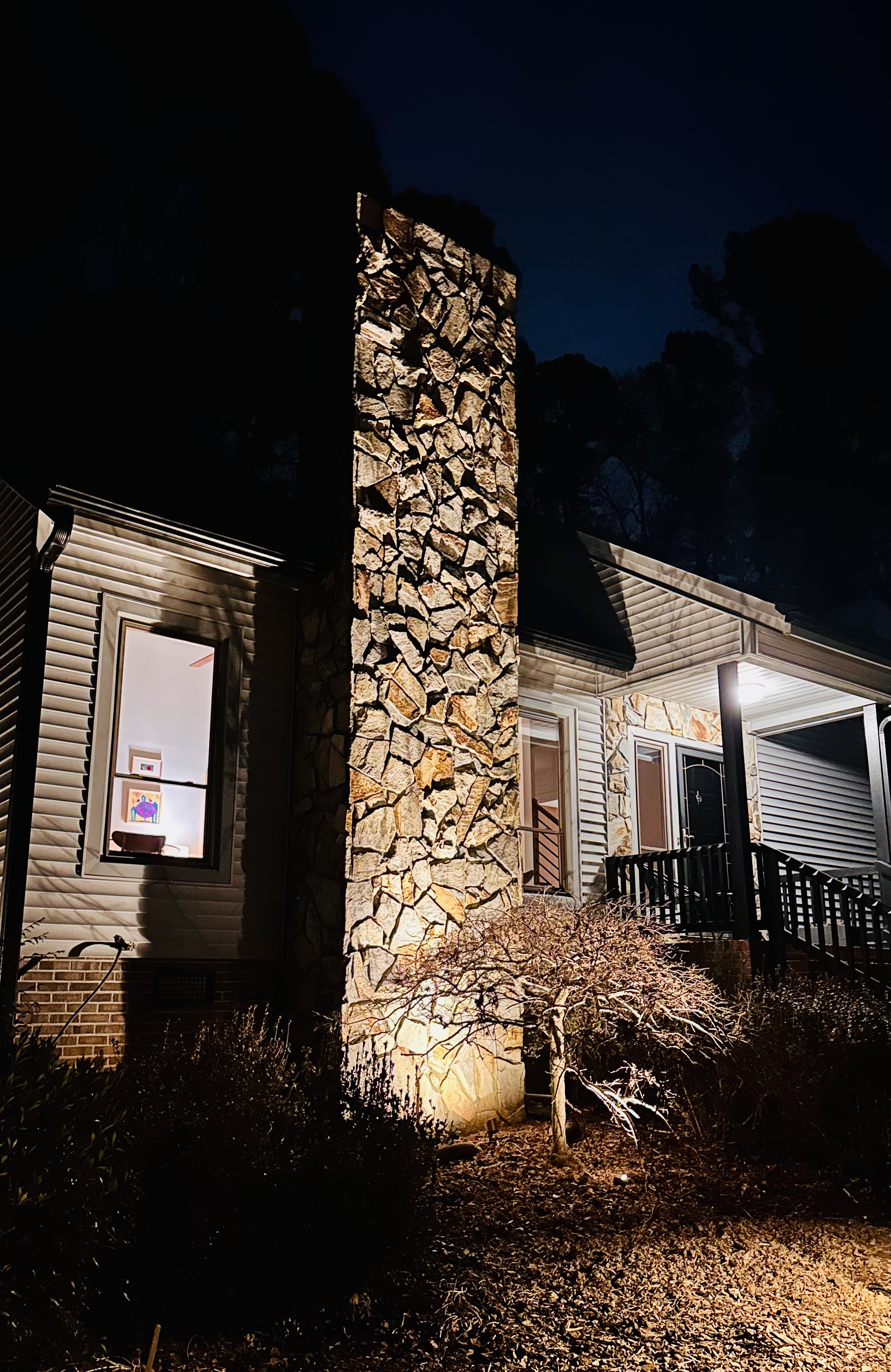 Stone column uplighting, North Raleigh home