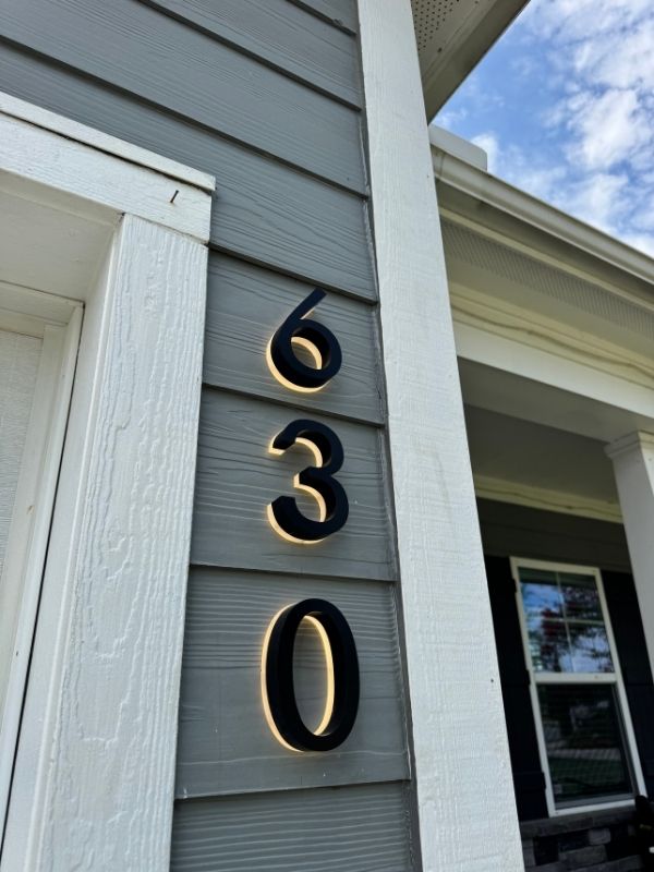 Illuminated stainless steel house numbers for premium front entry lighting